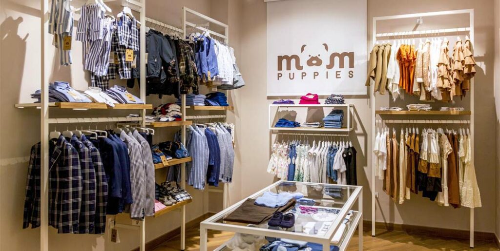 Abbigliamento negozio bambini, progettato e realizzato da Spettacolo Design